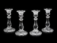 A Set of Four Molded Glass Candlesticks