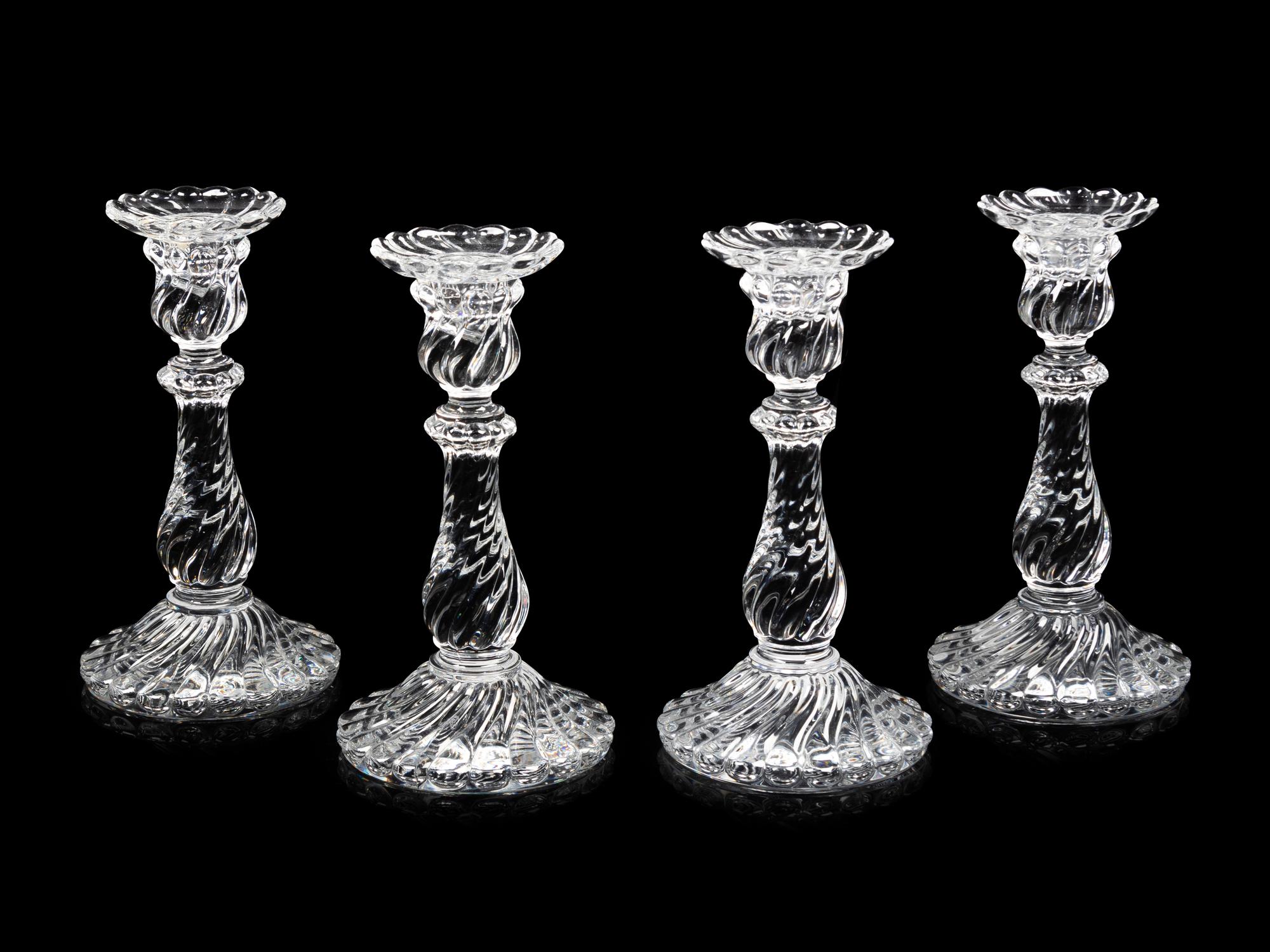 A Set of Four Molded Glass Candlesticks