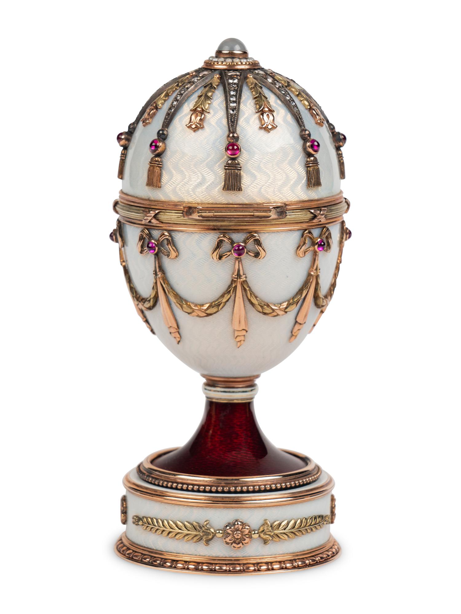 A 14 Karat Vari-Color Gold, Silver, Guilloché Enamel, Diamond, Pearl, and Cabochon Jewel-Mounted Surprise Egg