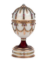 A 14 Karat Vari-Color Gold, Silver, Guilloché Enamel, Diamond, Pearl, and Cabochon Jewel-Mounted Surprise Egg