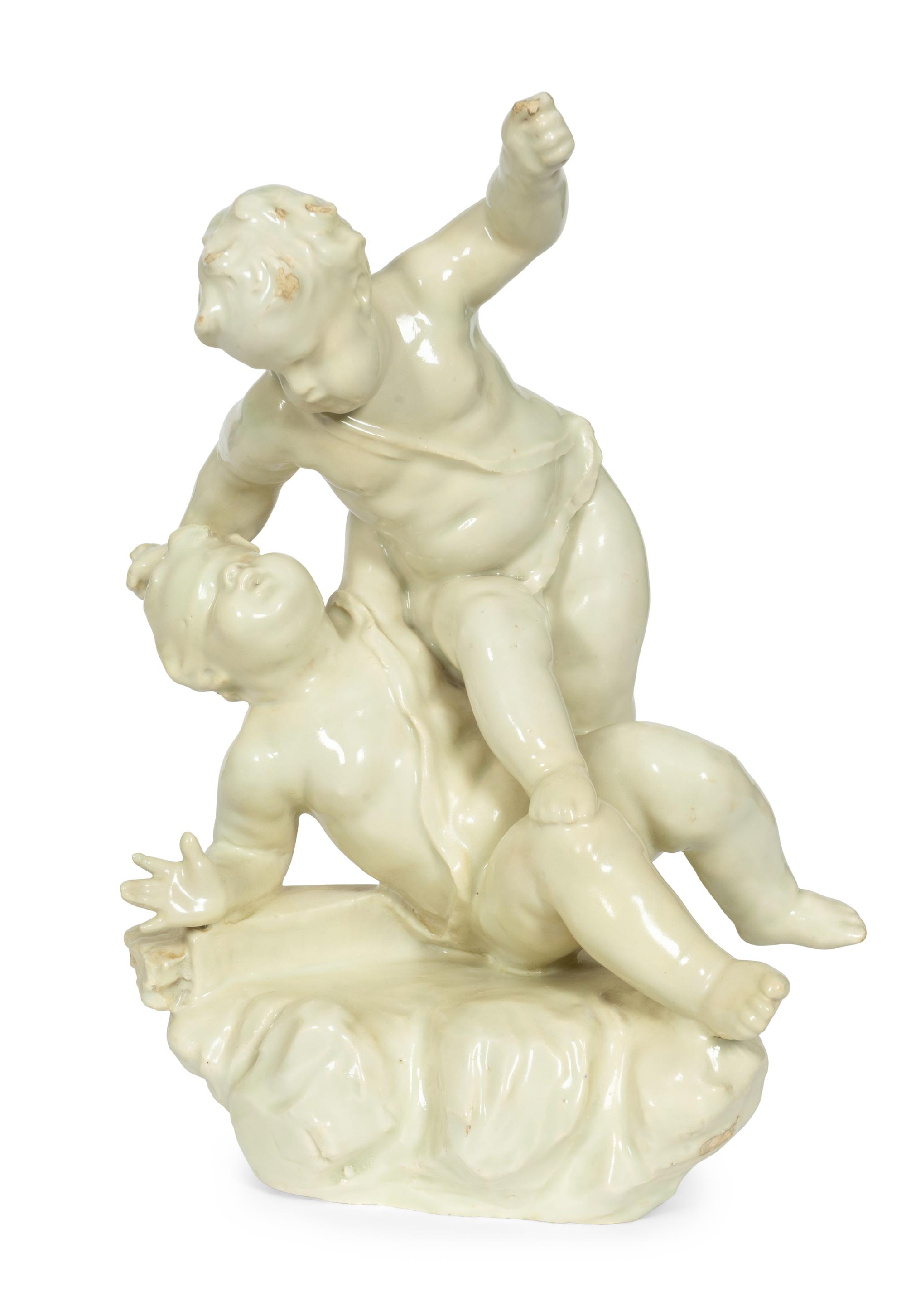 A Continental White-Glazed Faience Putti Group