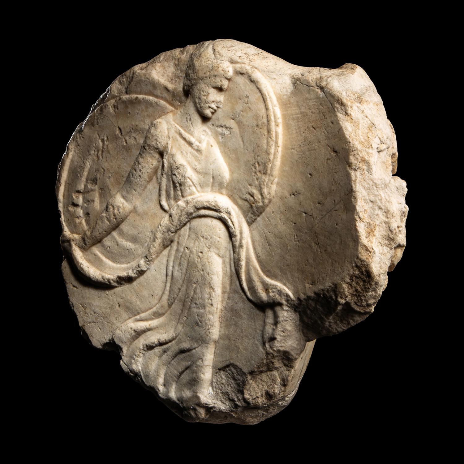 A Roman Marble Oscillum with a Dancing Maenad