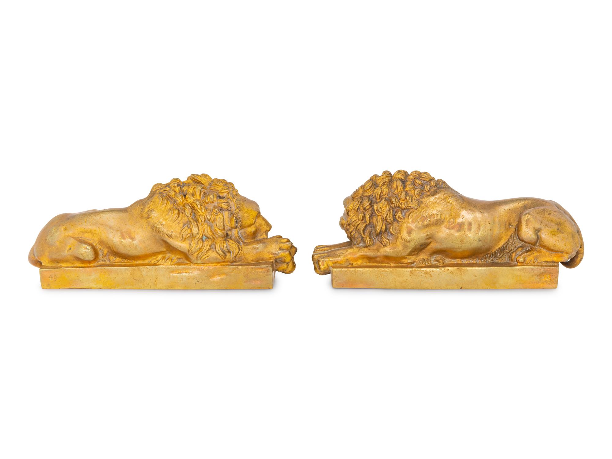 A Pair of Continental Bronze Recumbent Lions