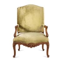 A Louis XV Style Carved Walnut Fauteuil