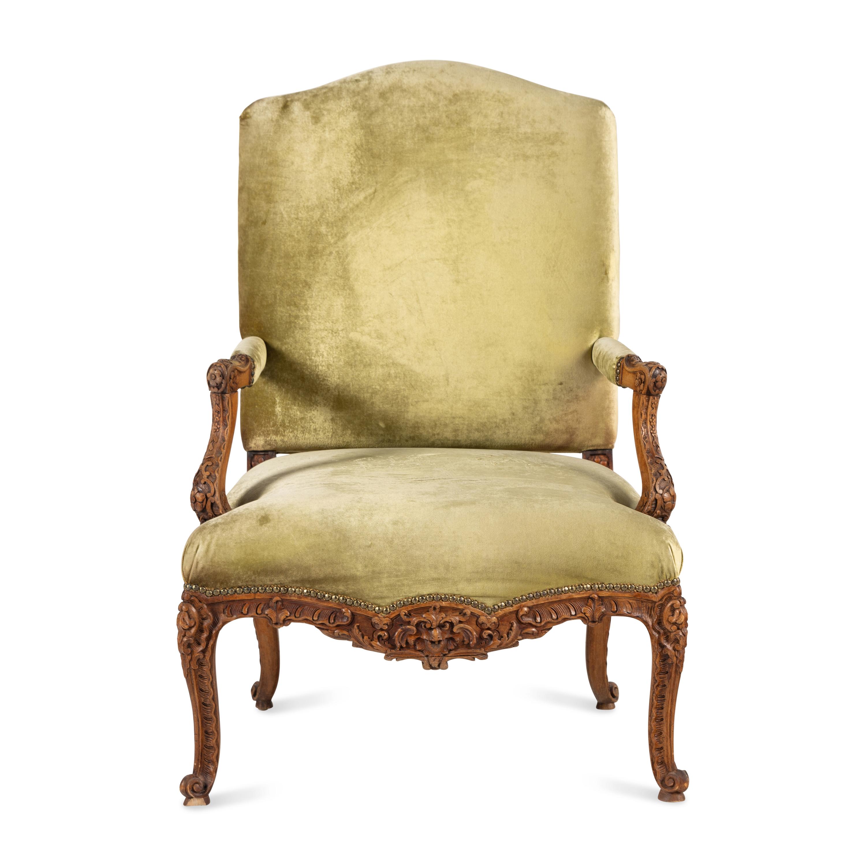 A Louis XV Style Carved Walnut Fauteuil