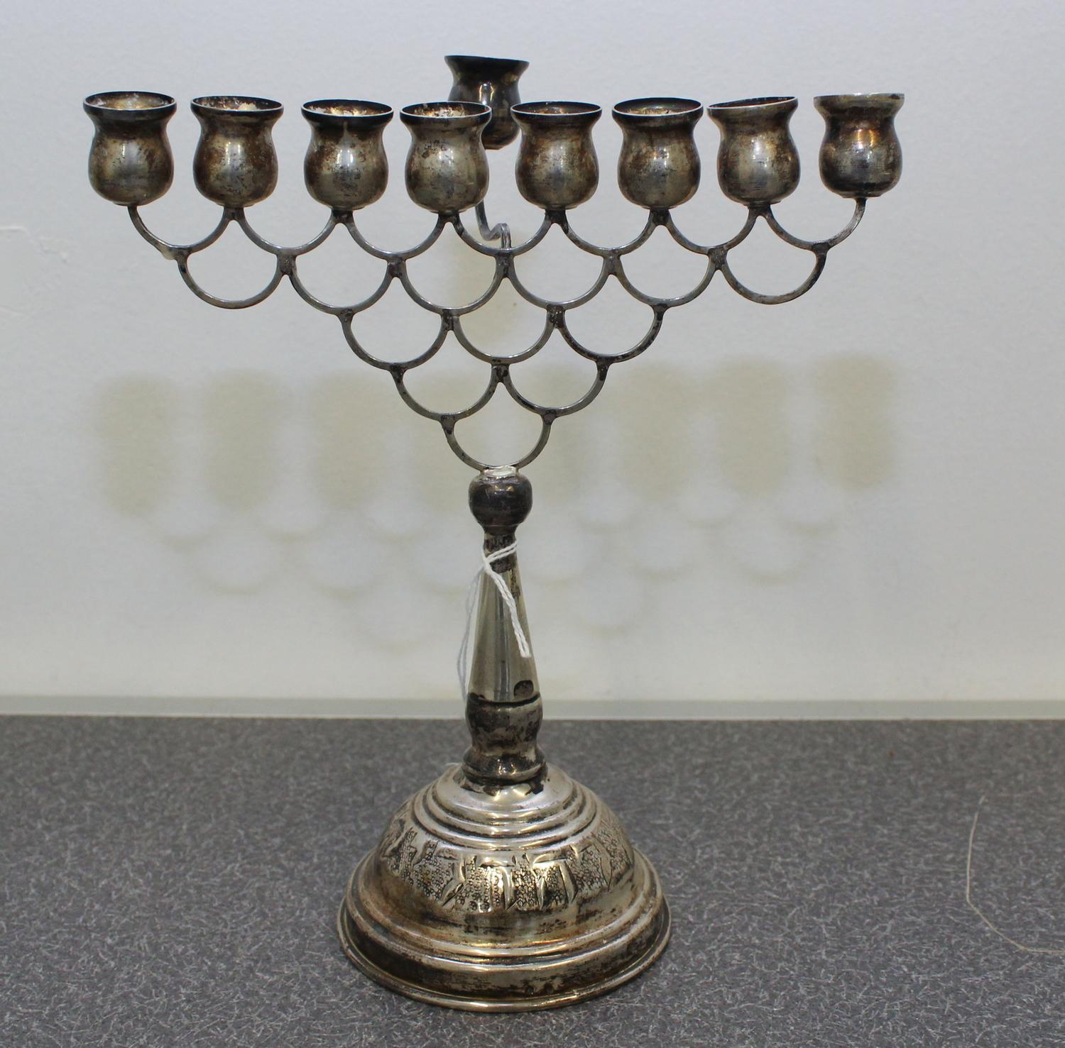 A Continental Silver Menorah Height 8 1/4 inches.