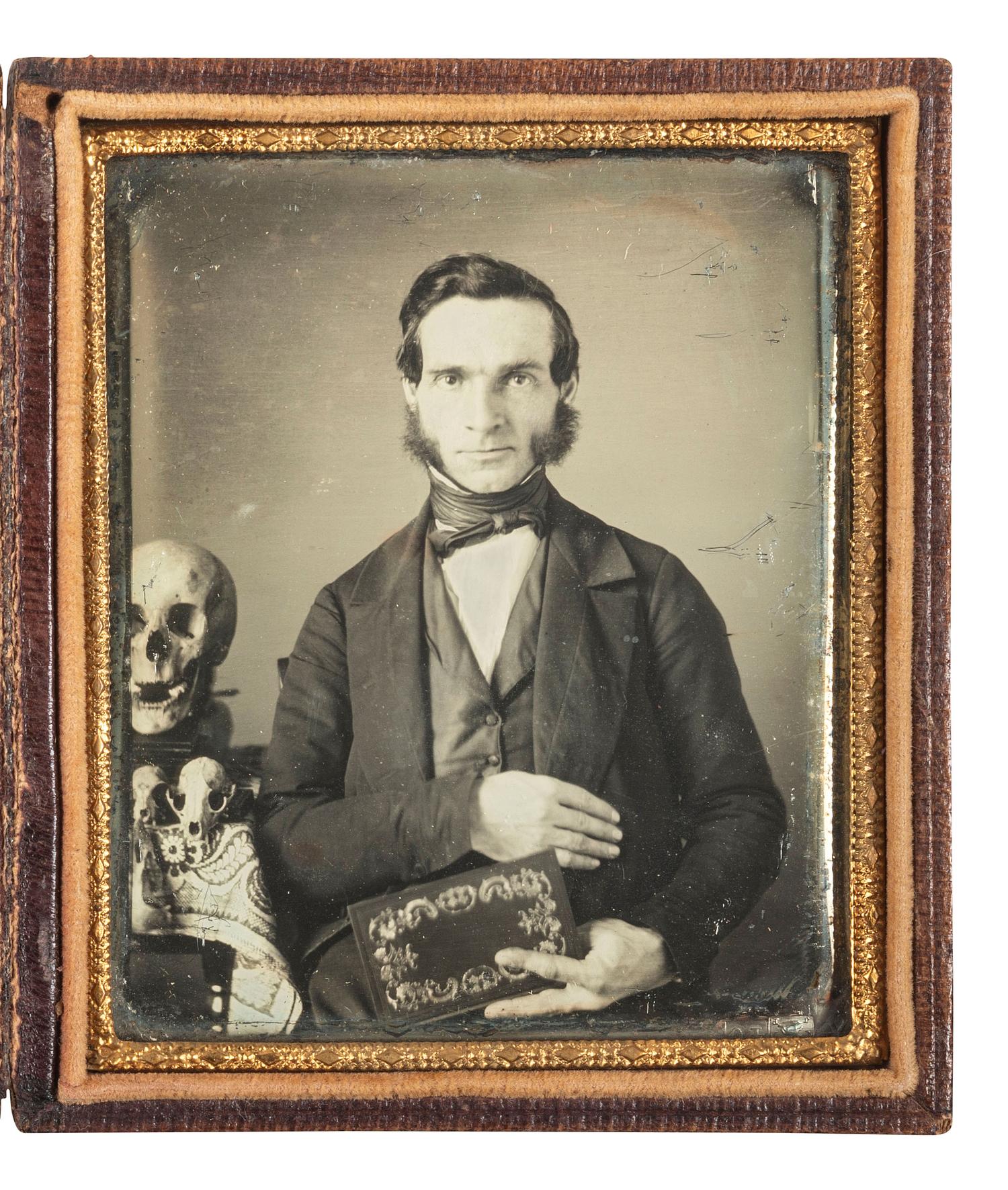 [EARLY PHOTOGRAPHY]. Sixth plate daguerreotype of a naturalist with skulls.