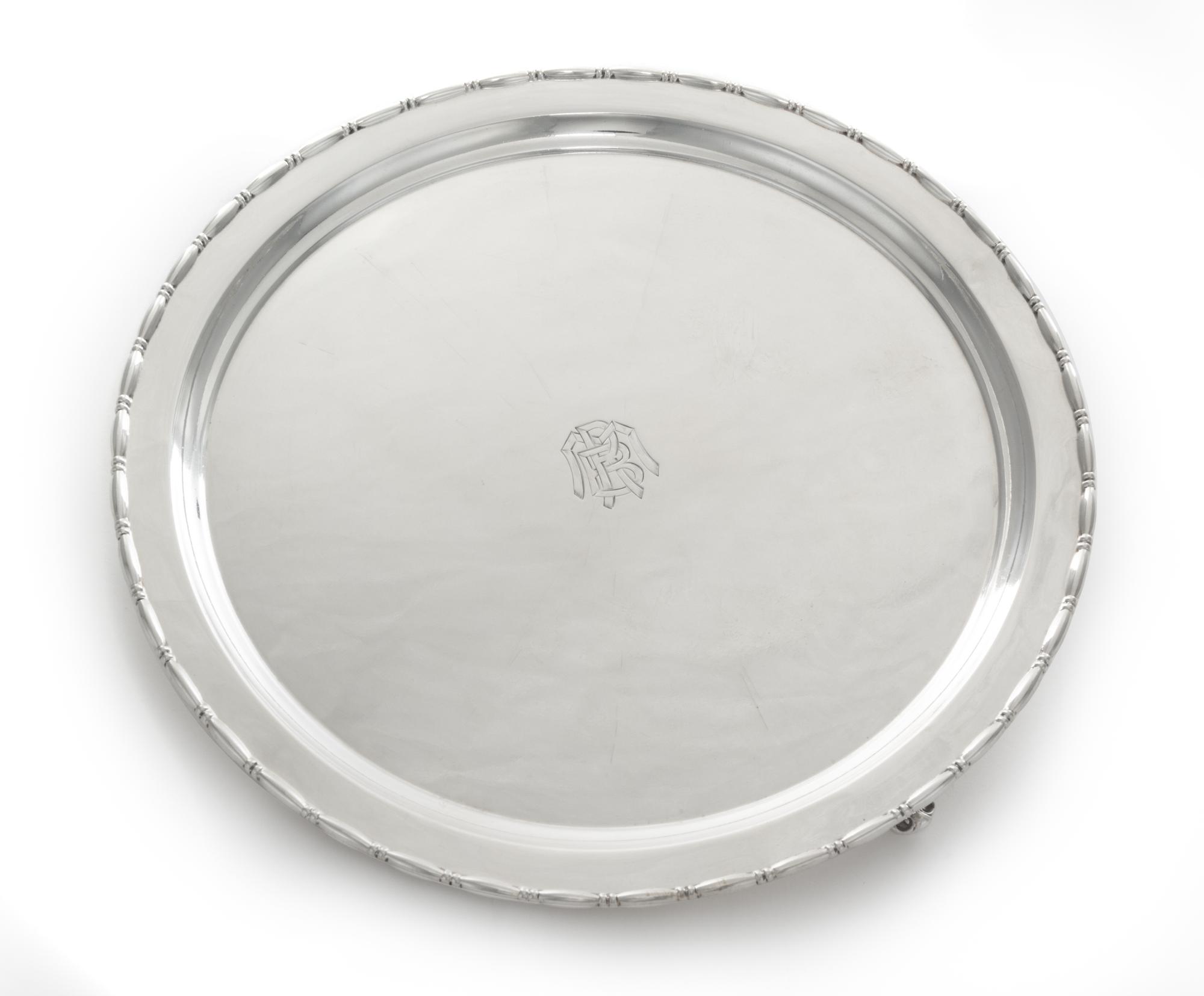 An American Silver Salver, Reed & Barton, Taunton, MA, First half 20th century, of shaped circular form raised on three openwork bracke