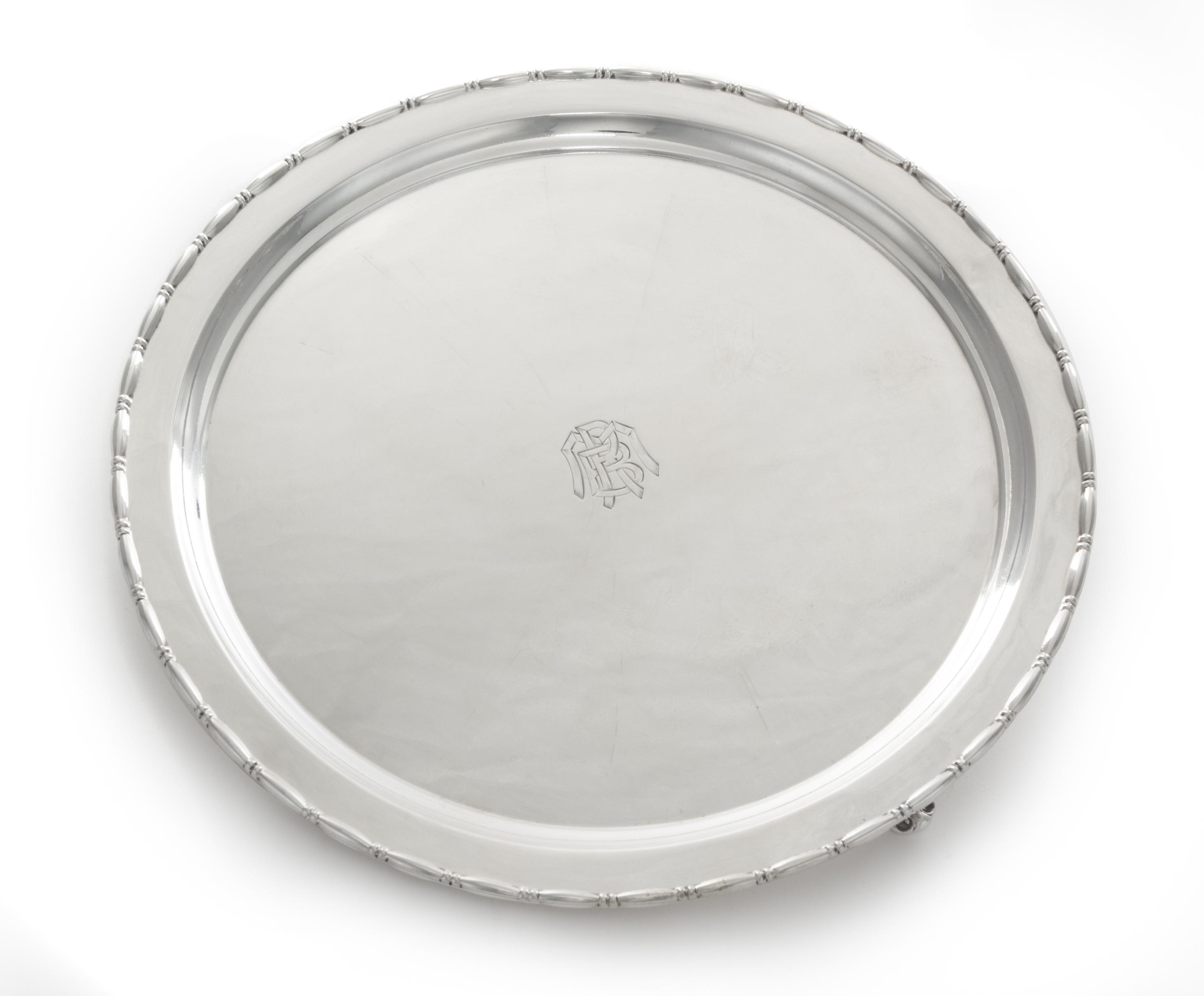 An American Silver Salver, Reed & Barton, Taunton, MA, First half 20th century, of shaped circular form raised on three openwork bracke