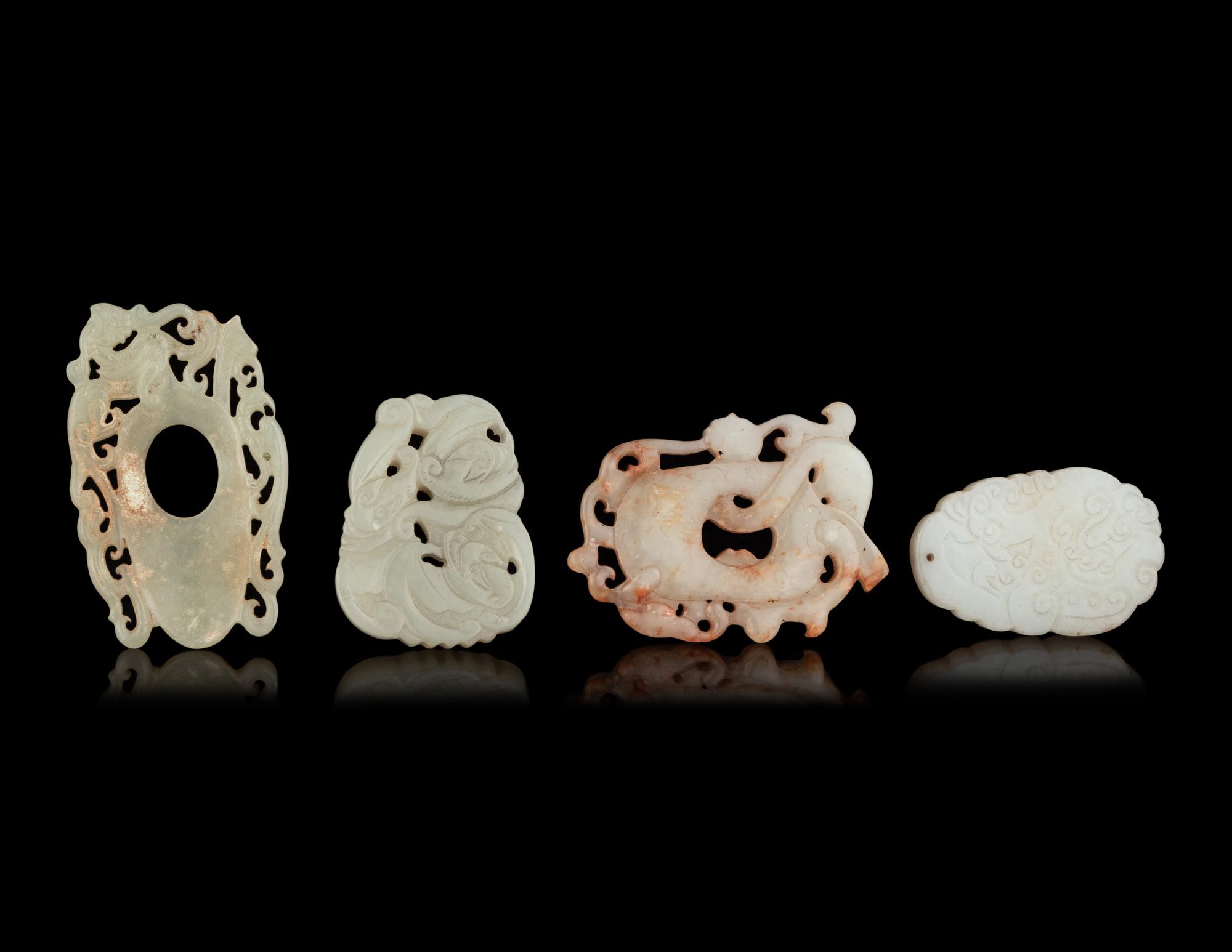 Seven Chinese Carved Celadon Jade Pendants