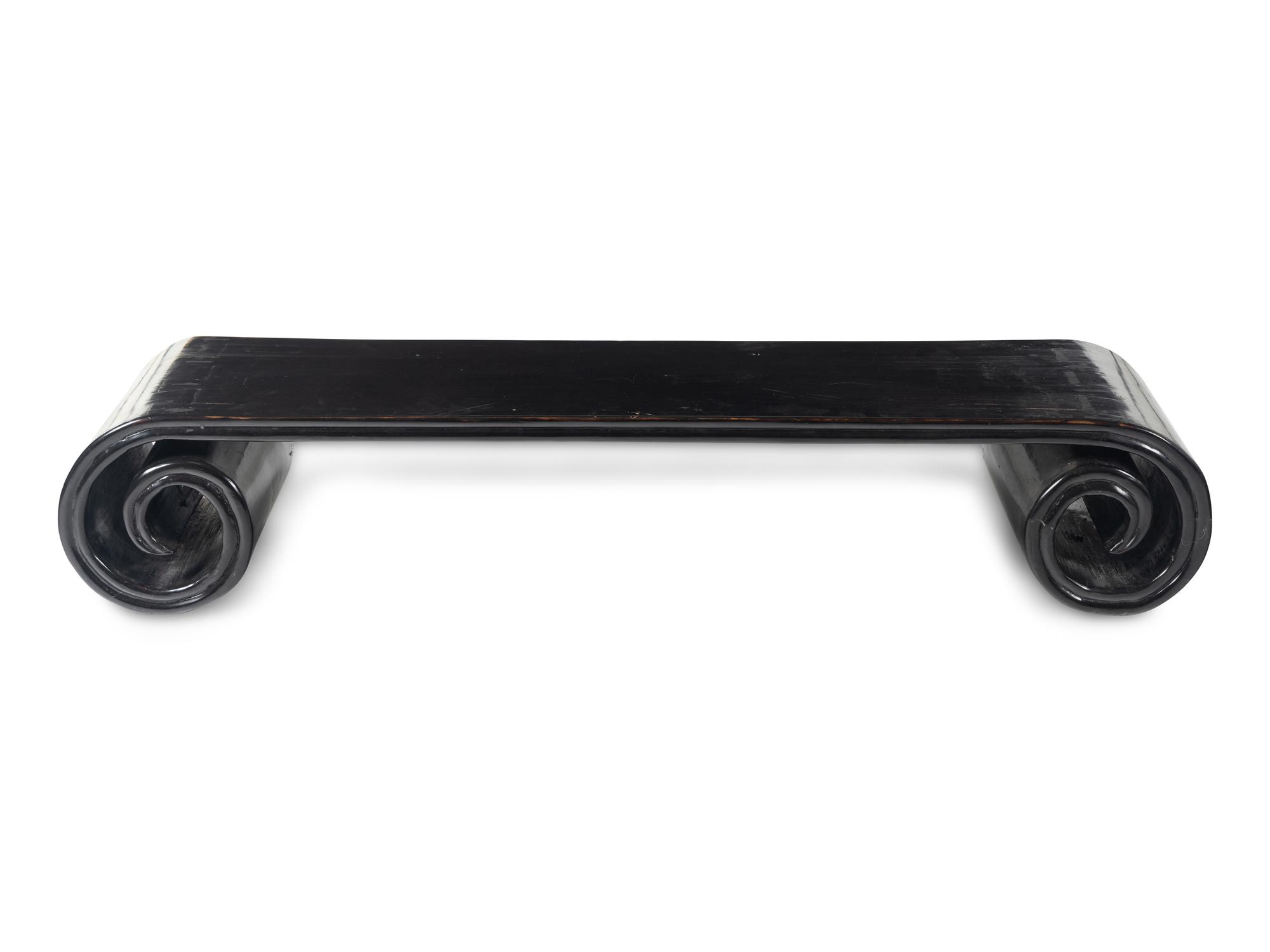A Chinese Black Lacquered Low Scrolled-Form Low Table, Qinzhuo