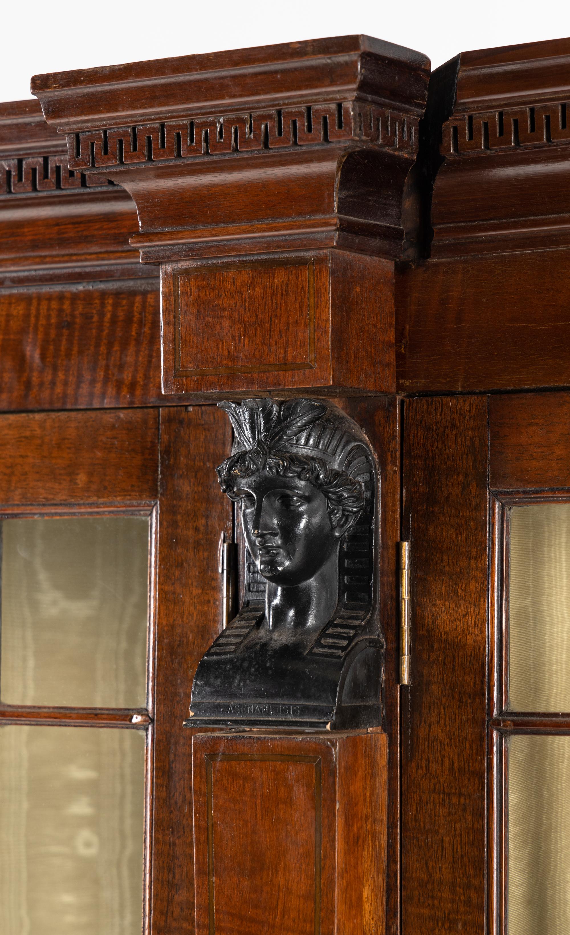 A Regency Part Ebonized Mahogany Breakfront Bookcase