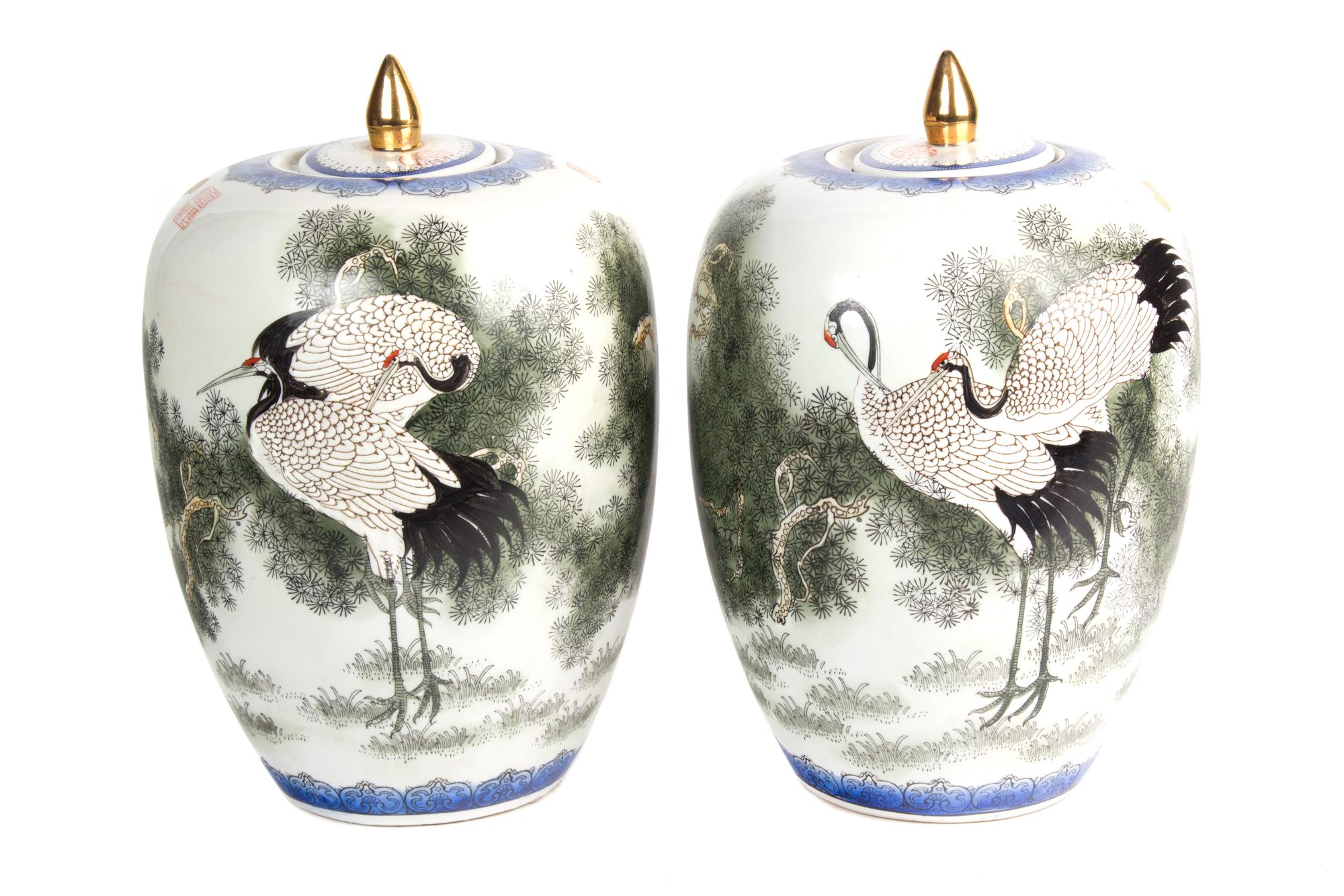 A Pair of Japanese Porcelain Ovoid Form Covered Vases Height 12 inches. — 20TH CENTURY