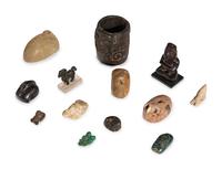 A Group of Twelve Pre-Colombian Style and Near Eastern Style Carved Stone Articles