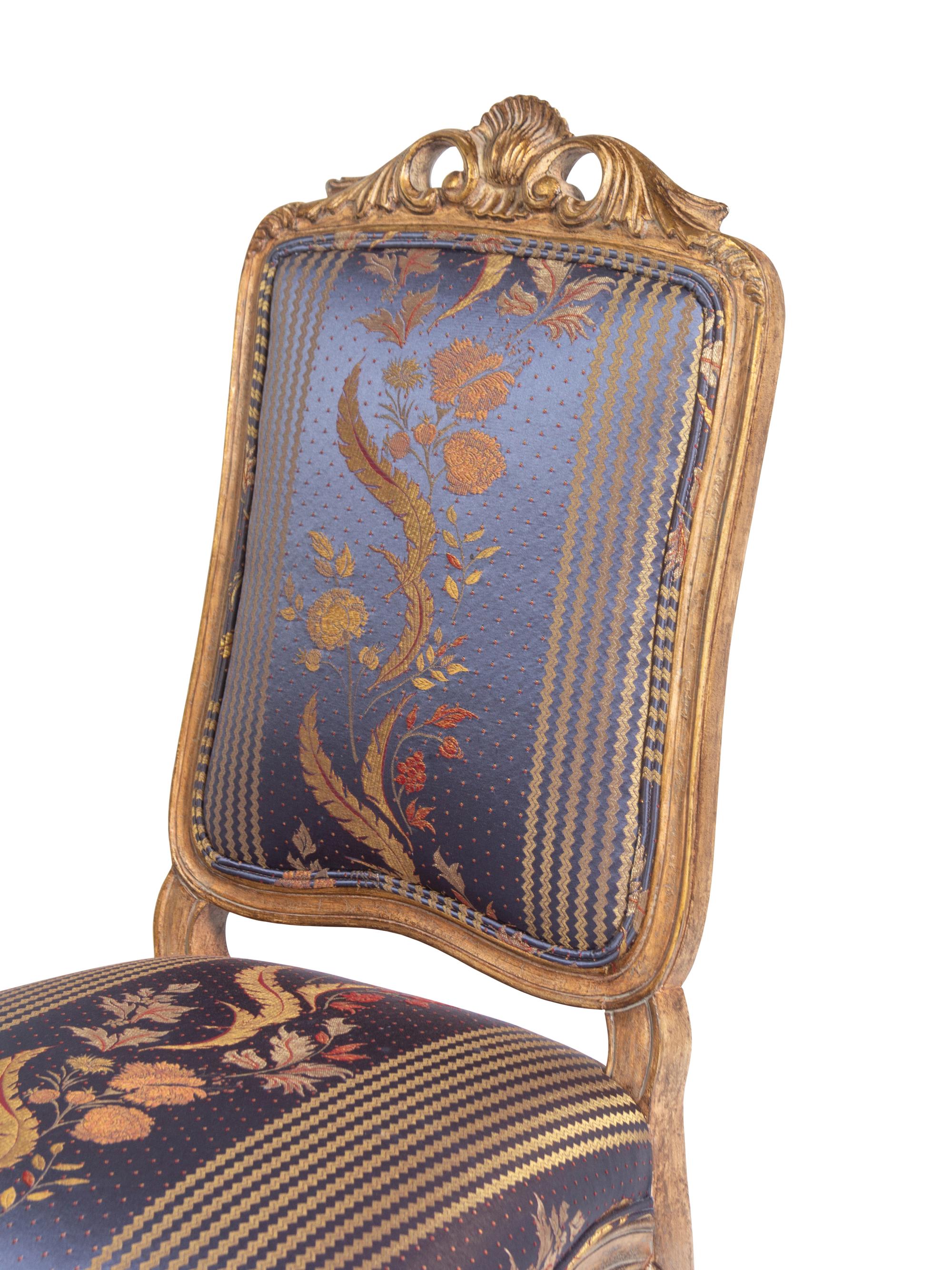 A Set of Twelve Louis XV Style Giltwood Dining Chairs