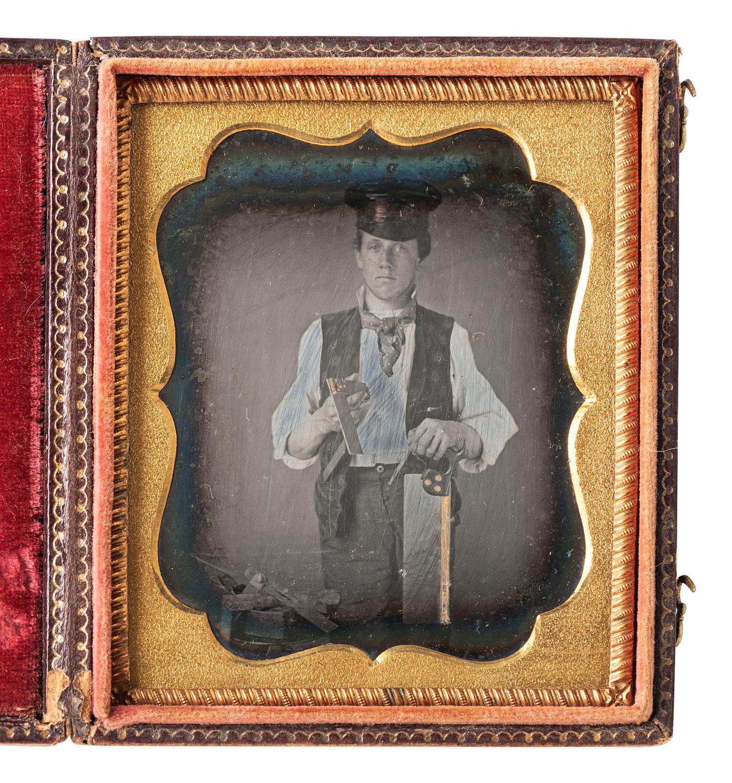 [EARLY PHOTOGRAPHY]. Sixth plate daguerreotype featuring a carpenter with gold-highlighted tools.