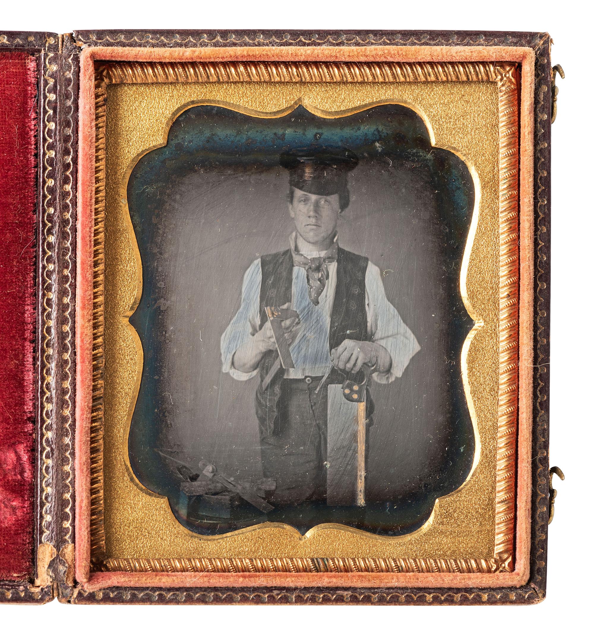 [EARLY PHOTOGRAPHY]. Sixth plate daguerreotype featuring a carpenter with gold-highlighted tools.