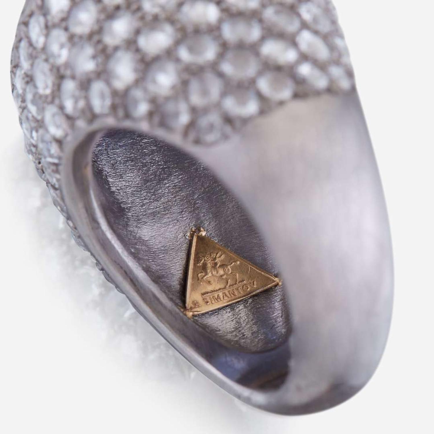 A sapphire, diamond, and platinum ring, R Simantov