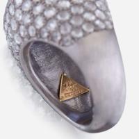 A sapphire, diamond, and platinum ring, R Simantov