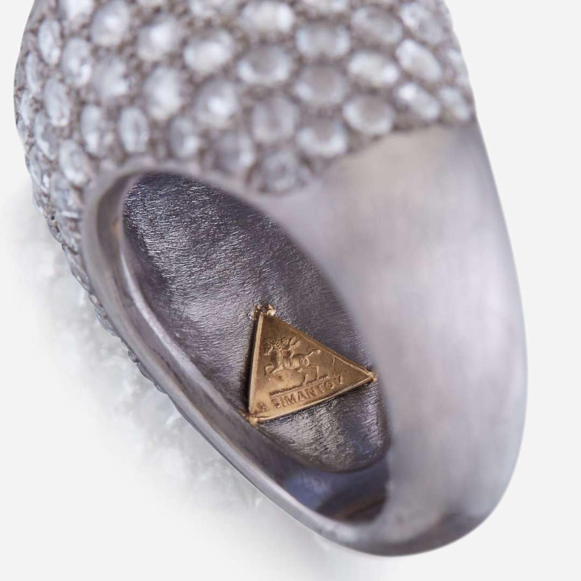 A sapphire, diamond, and platinum ring, R Simantov