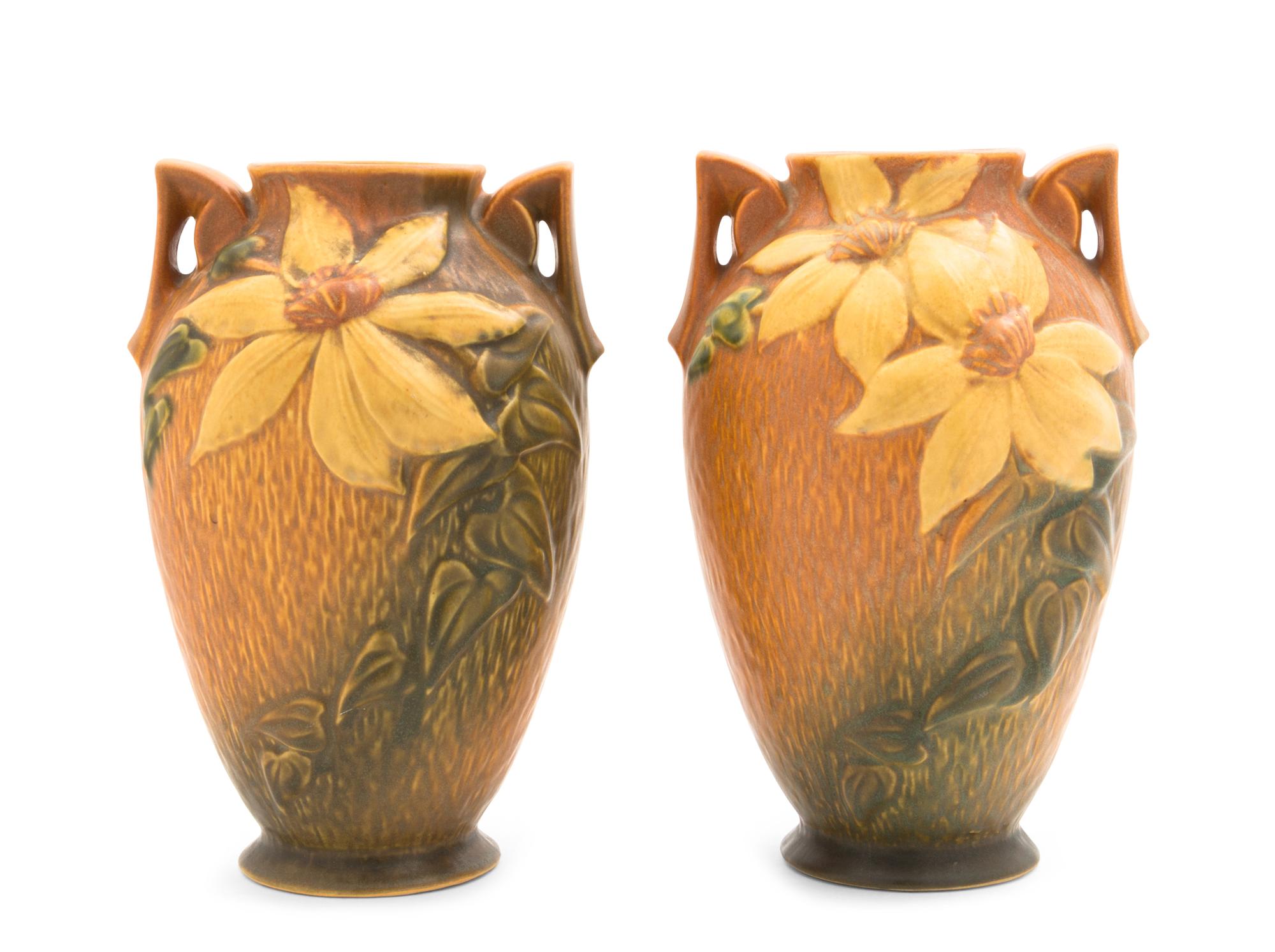 Three Roseville Clematis Pottery Vases Height of first 12 1/4 inches, pair 9 1/4 inches.