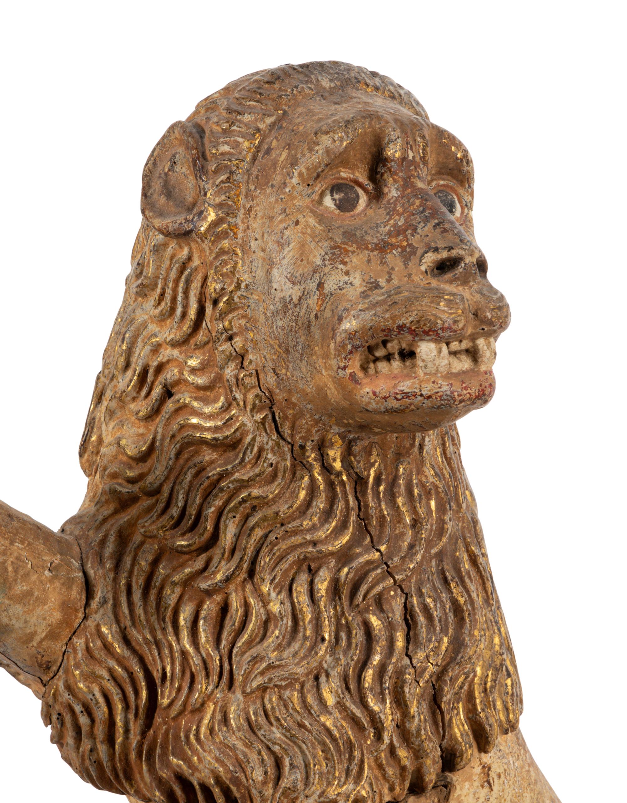A Spanish Carved Wood and Polychrome Decorated Rampant Lion