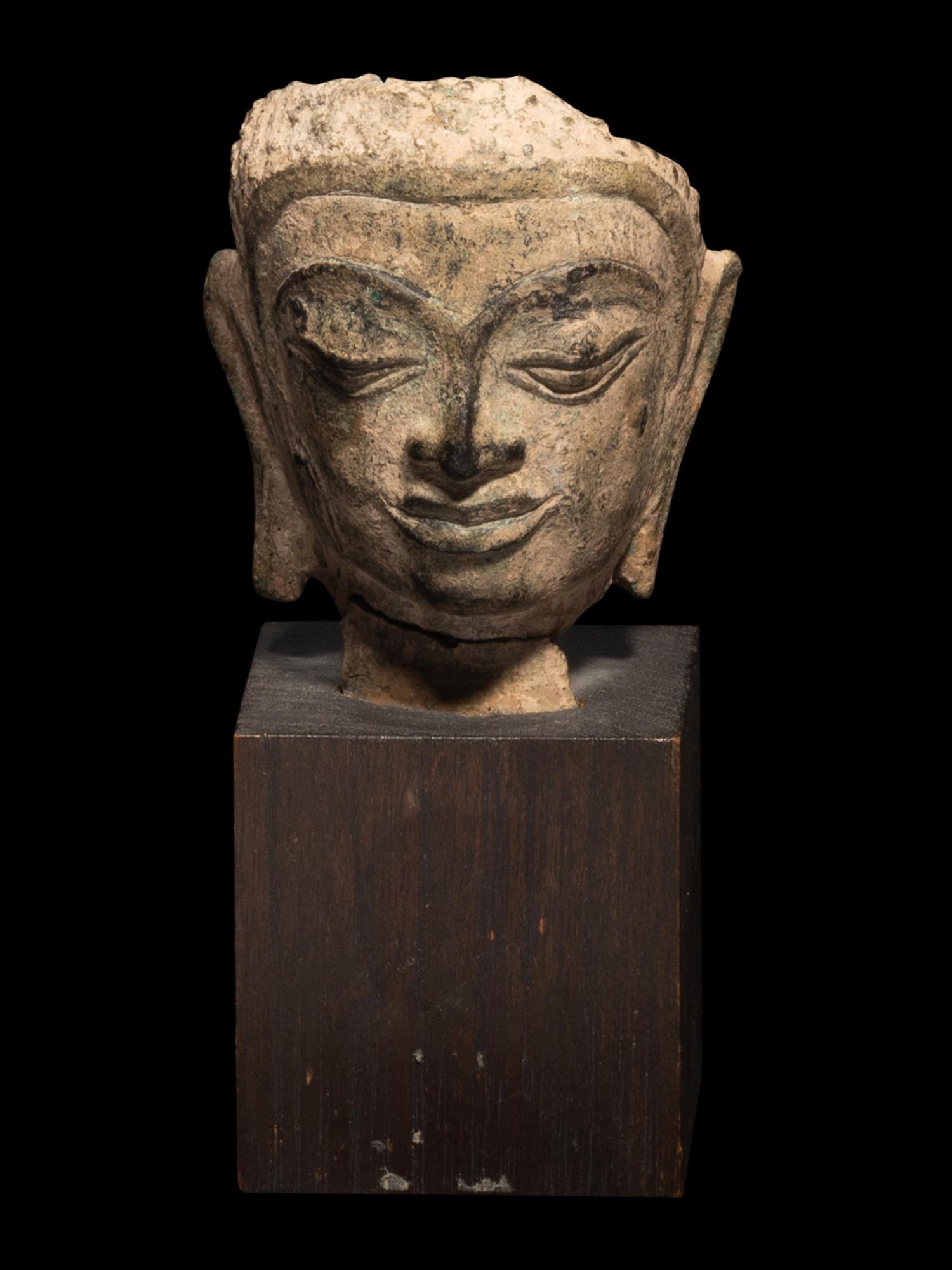 A Thai Bronze Figure of Standing Buddha and a Head of Buddha
