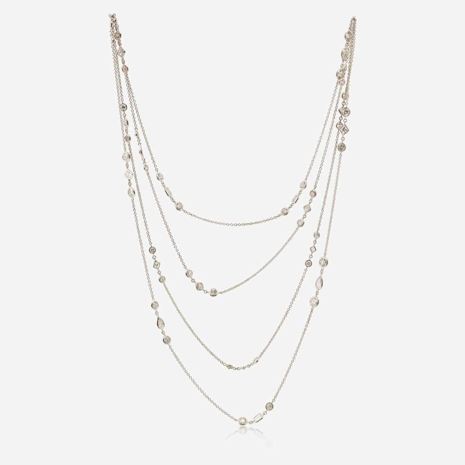 An 18K White Gold Diamond Long Station Chain