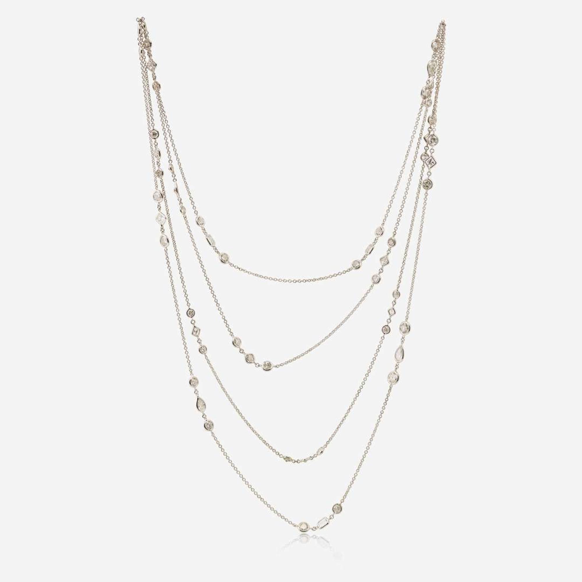 An 18K White Gold Diamond Long Station Chain