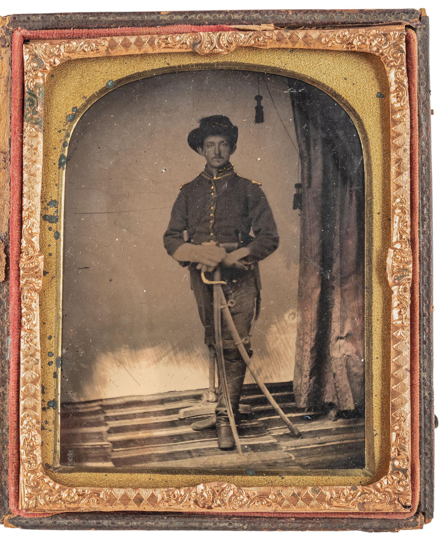 [CIVIL WAR]. Quarter plate tintype of triple-armed Union cavalryman. N.p.: n.p., [1860s].
