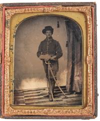 [CIVIL WAR]. Quarter plate tintype of triple-armed Union cavalryman. N.p.: n.p., [1860s].