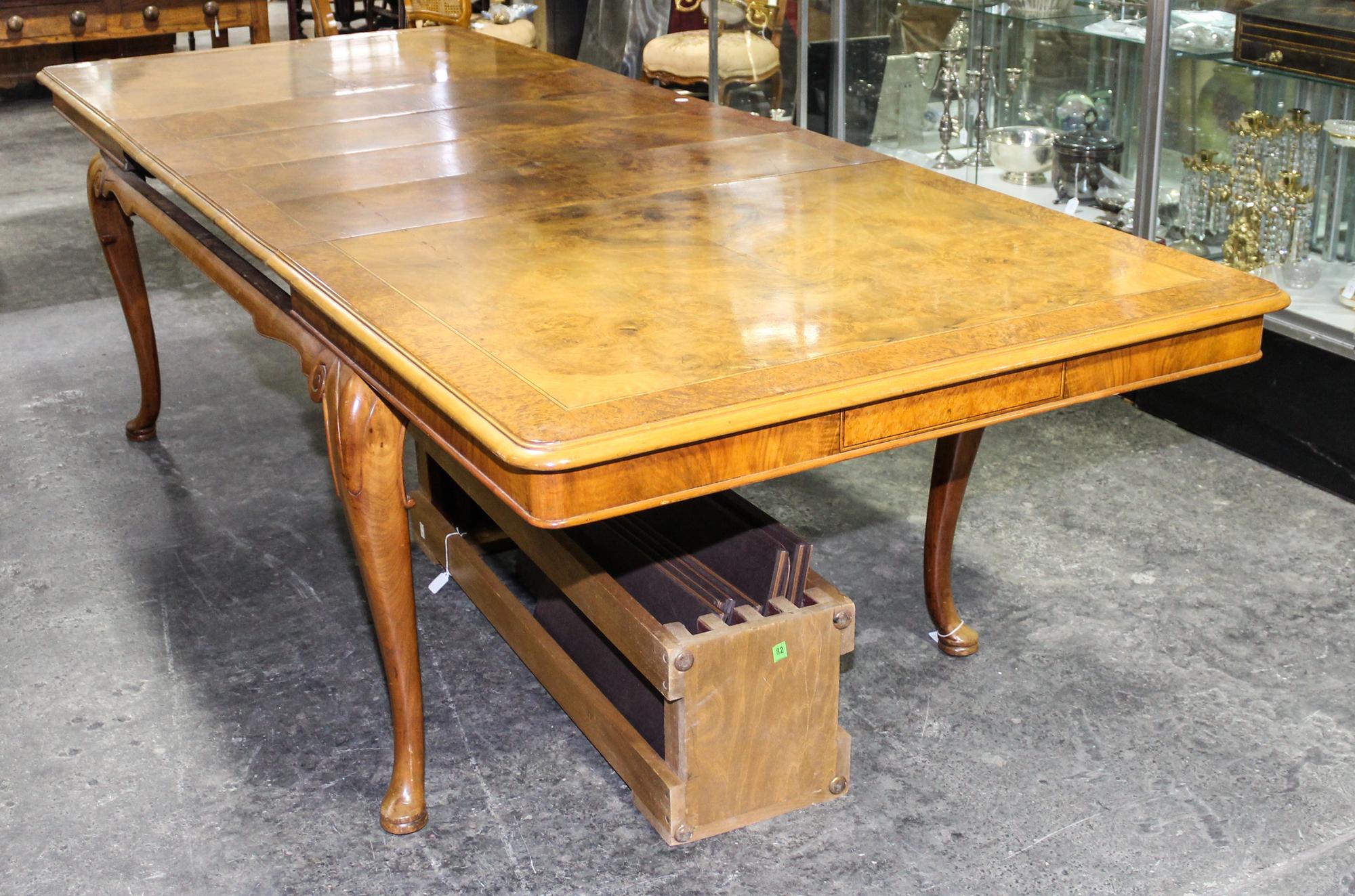 A Queen Anne Style Burlwood Dining Table Height 29 1/2 x width 66 x depth 41 1/2 inches. — FIRST HALF 20th CENTURY
