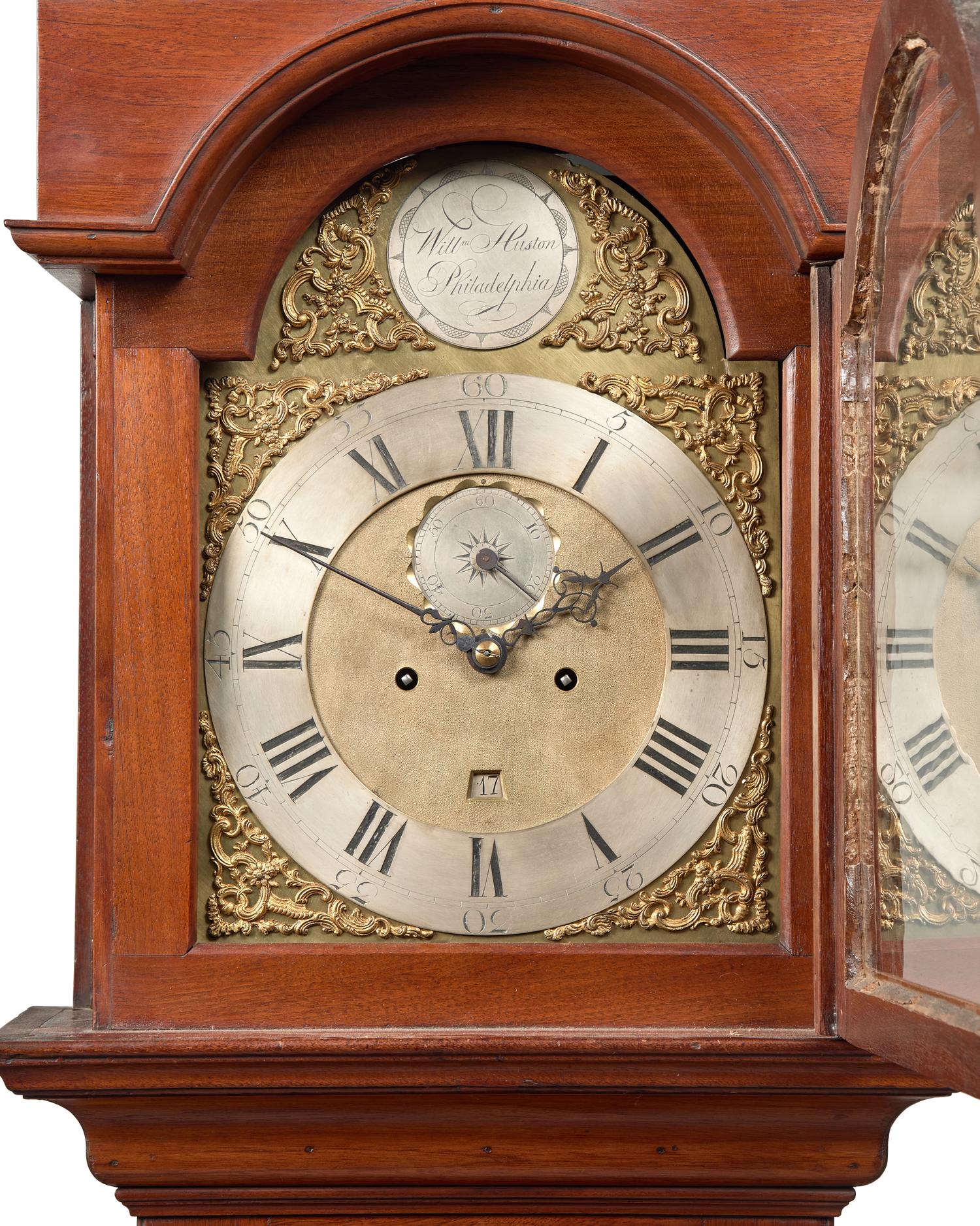 A Fine Queen Anne Carved and Figured Walnut Eight-Day Tall Case Clock