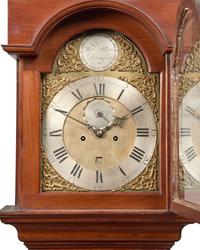 A Fine Queen Anne Carved and Figured Walnut Eight-Day Tall Case Clock