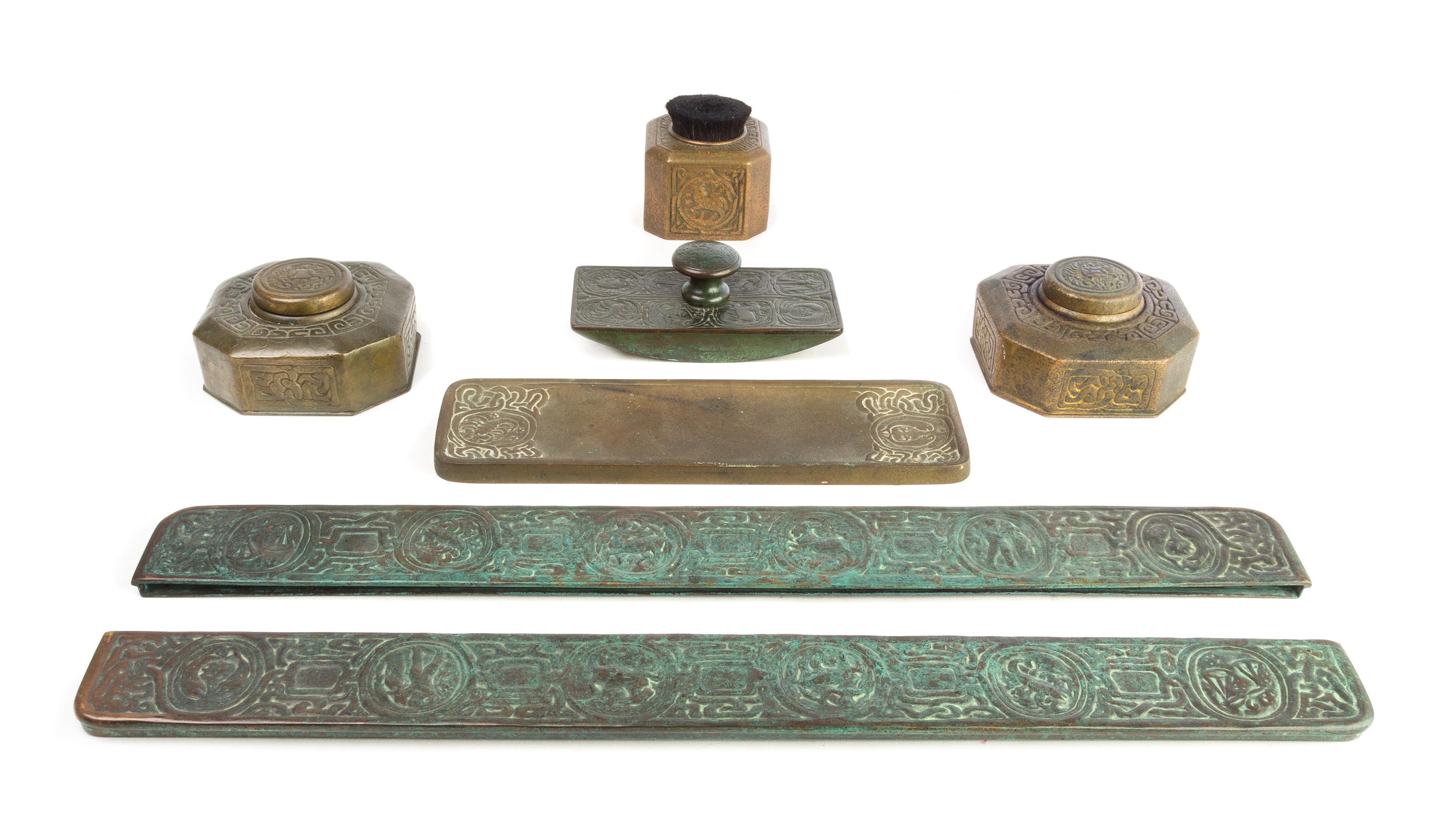 Tiffany Studios, EARLY 20TH CENTURY, a Zodiac pattern seven-piece desk set