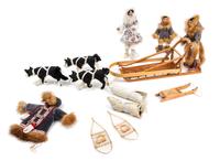 A Sled Dog Team Length of largest sled 9 1/8 inches.