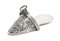 A Peruvian Silver Ornamental Stirrup, , chased with fruit and flowers.