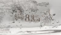 A Pair of German Silver Three-Light Candelabra, Gebruder Deyhle, Schwabisch Gmund, 20th Century, each stem issuing two scrolling candle