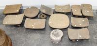 A Group of Eleven Pre-Columbian Stone Grain Grinding Stools Height of largest 7 1/4 x width 17 x depth 12 1/2 inches.