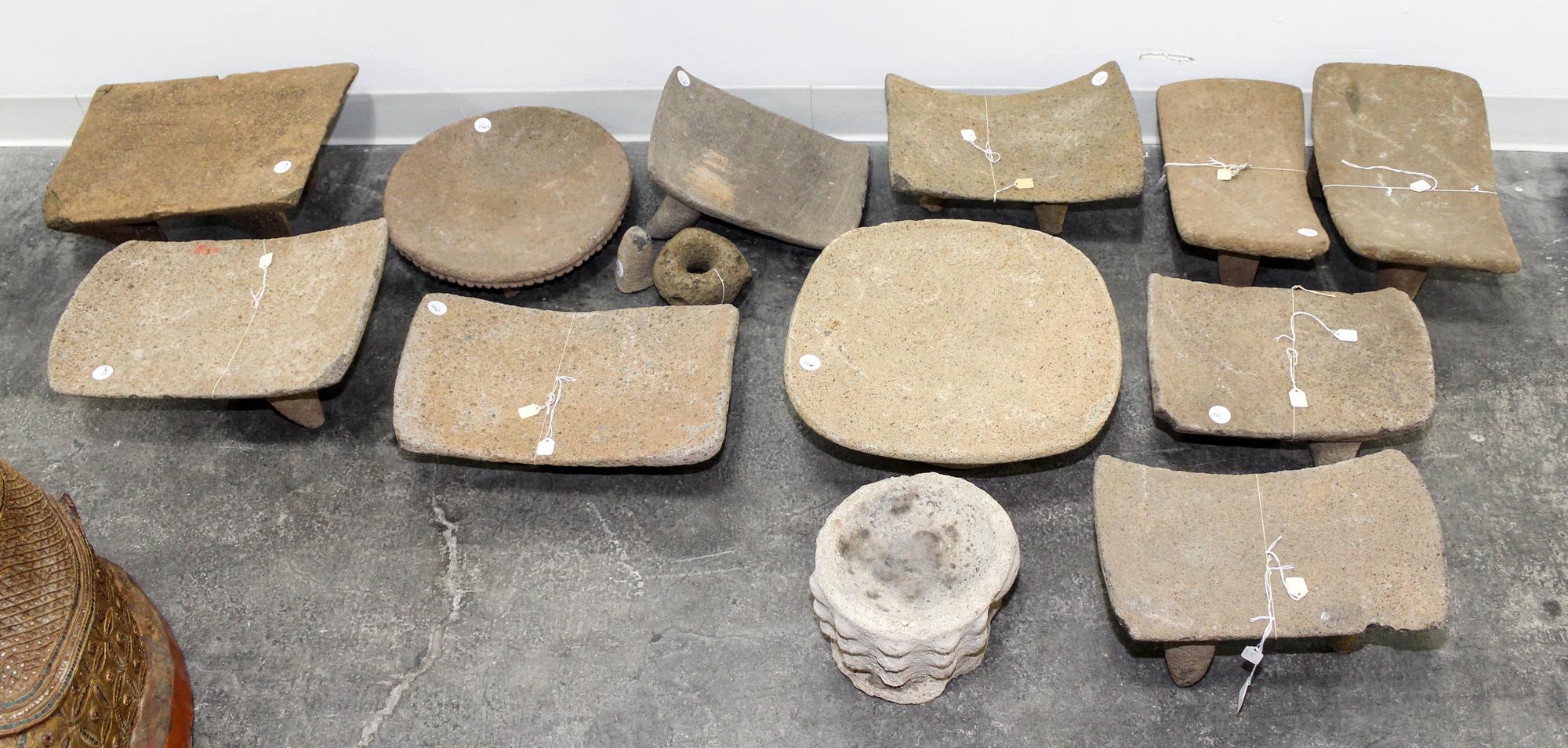 A Group of Eleven Pre-Columbian Stone Grain Grinding Stools Height of largest 7 1/4 x width 17 x depth 12 1/2 inches.