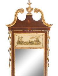 A Federal Style Parcel Gilt Mahogany and Églomisé Mirror