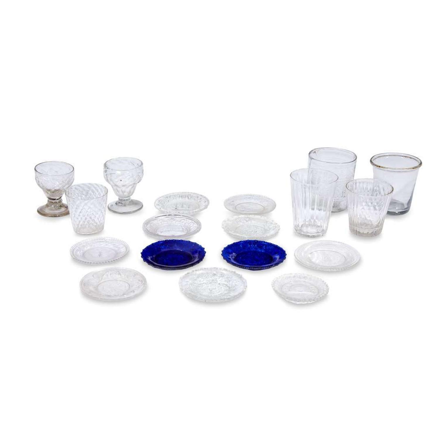 Group of uncolored mold-blown and uncolored and dark blue pressed glass tablewares 19th century