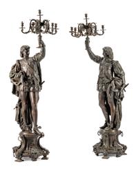 A Pair of French Patinated Metal Figural Torcheres
