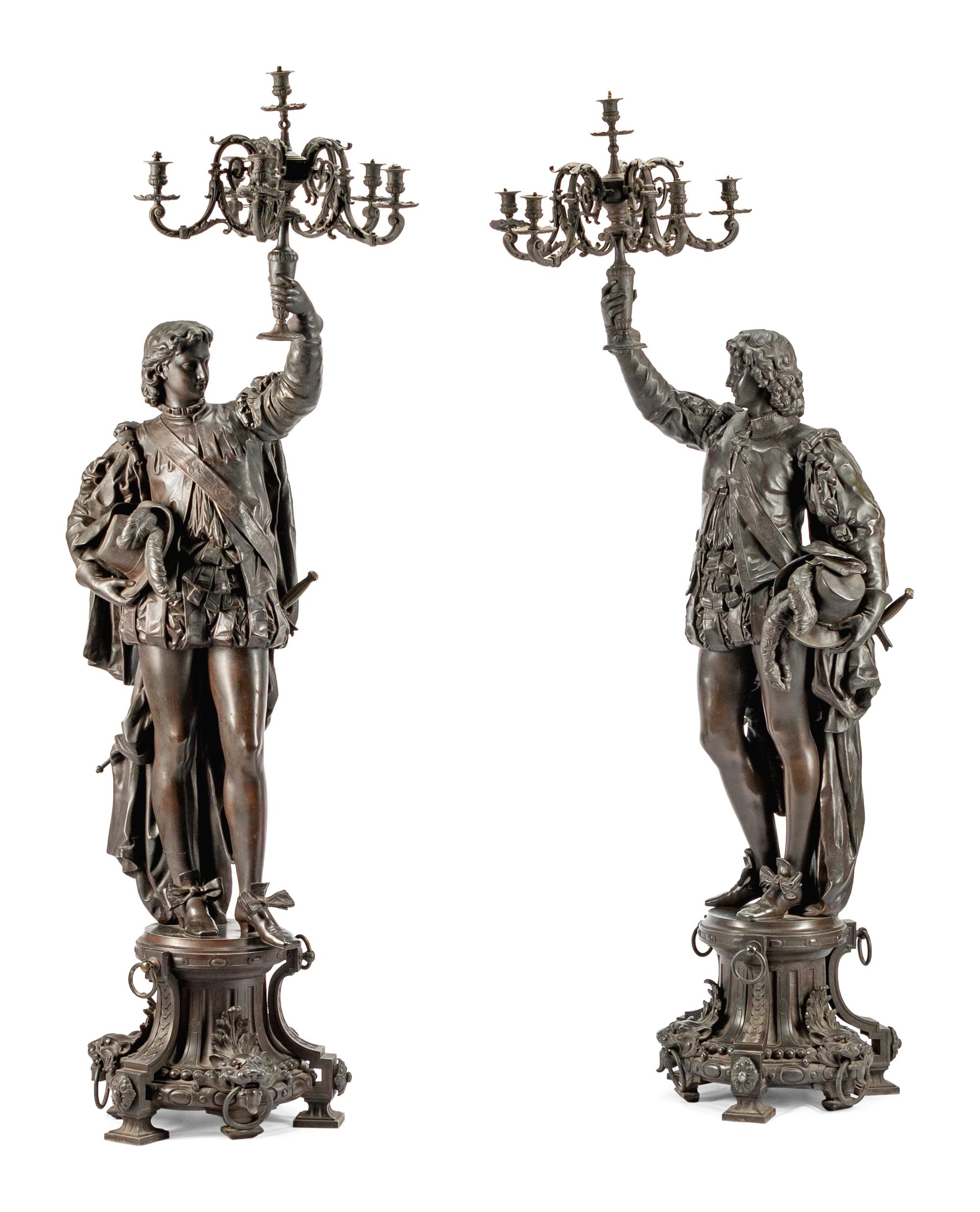 A Pair of French Patinated Metal Figural Torcheres