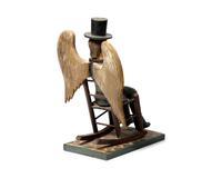 A Carved And Painted Figure Of A Seated Abraham Lincoln With Wings Painted As American Flag
