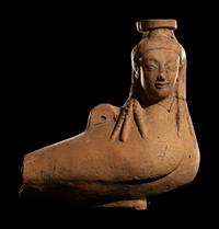 A Rhodian Pottery Figural Vessel in the Form of a Siren