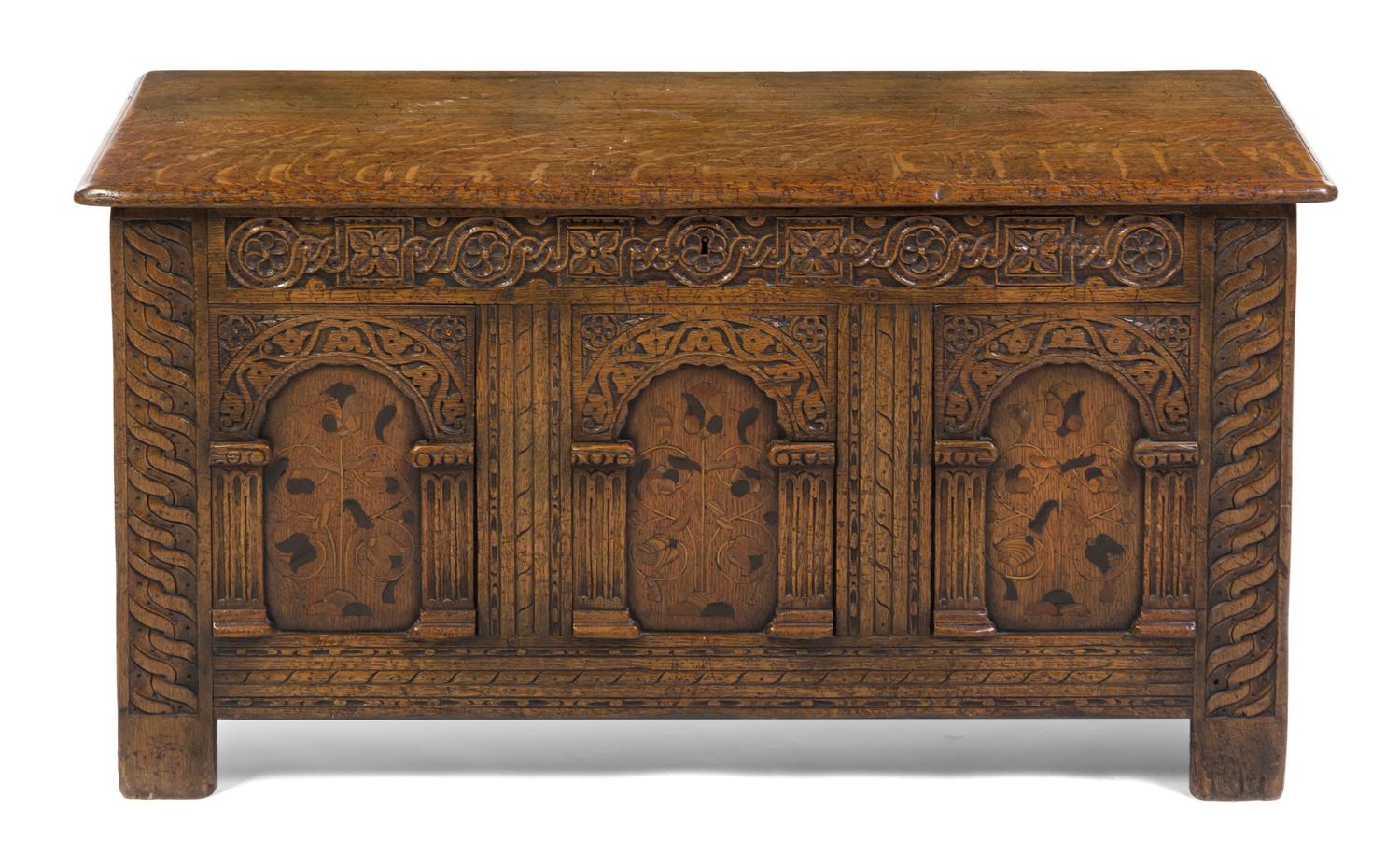 A Continental Carved Oak and Marquetry Decorated Cassone, Height 23 1/2 x width 48 x depth 19 1/4 inches.