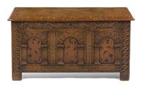 A Continental Carved Oak and Marquetry Decorated Cassone, Height 23 1/2 x width 48 x depth 19 1/4 inches.
