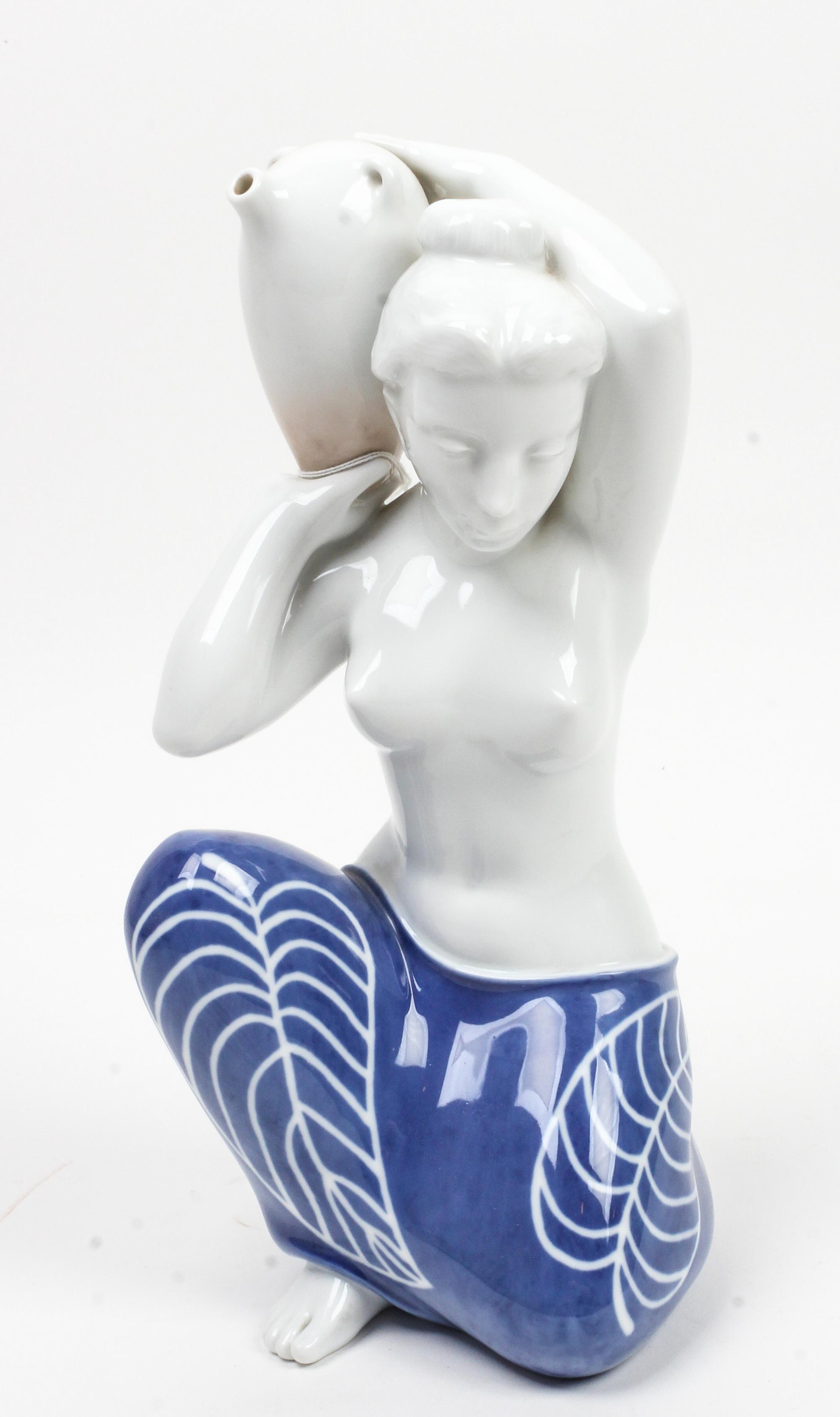 A Royal Copenhagen Porcelain Figure Height 12 1/4 inches.