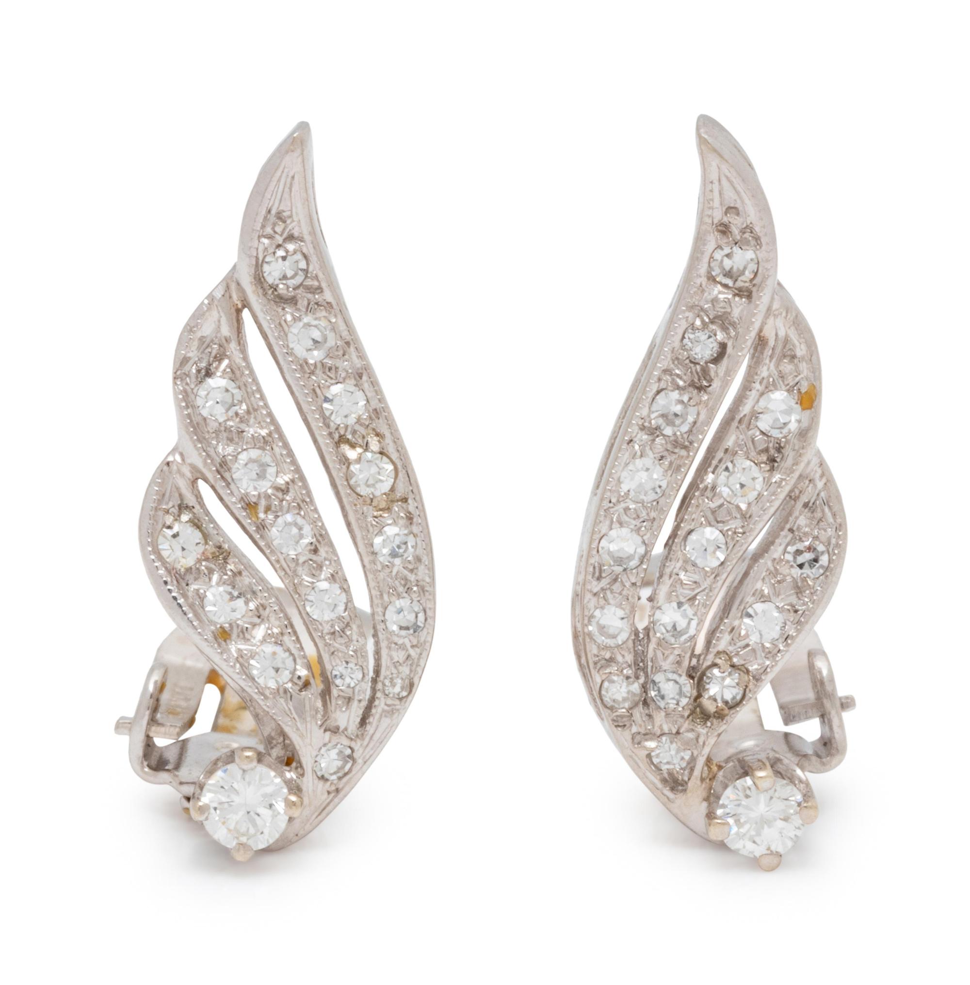 A Pair of White Gold and Diamond Earclips,